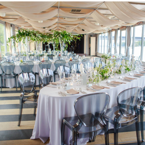Elliptical table with white tablecloth