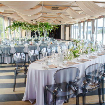 Elliptical table with white tablecloth